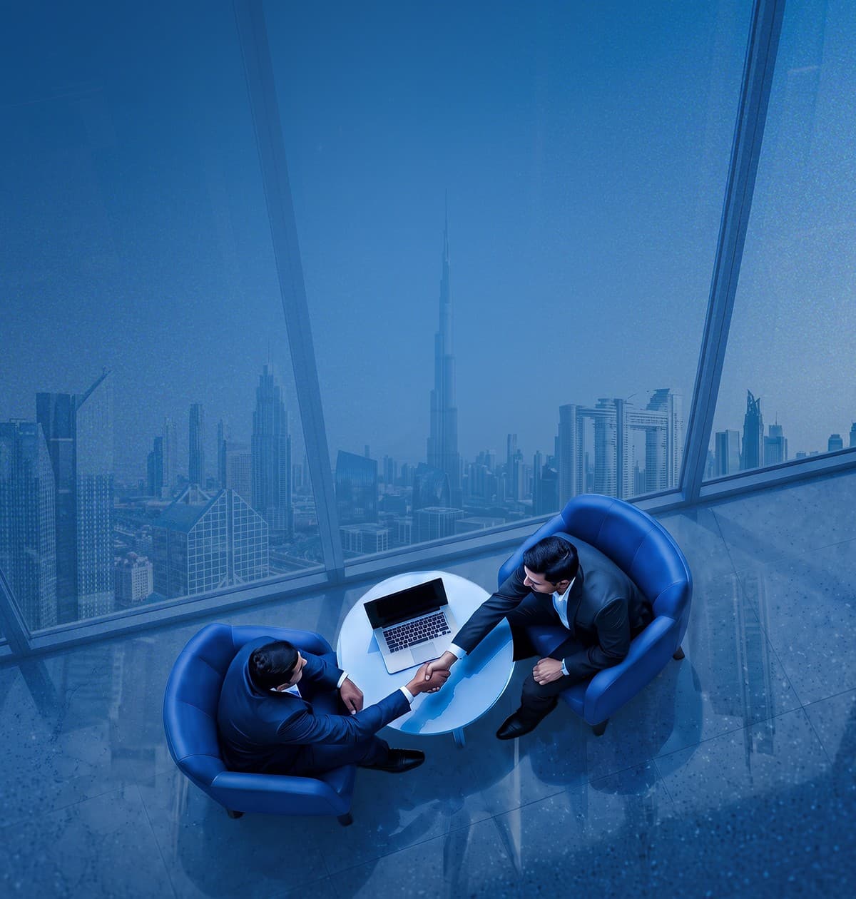 Two businessmen shaking hands in a high-rise office overlooking the Dubai skyline